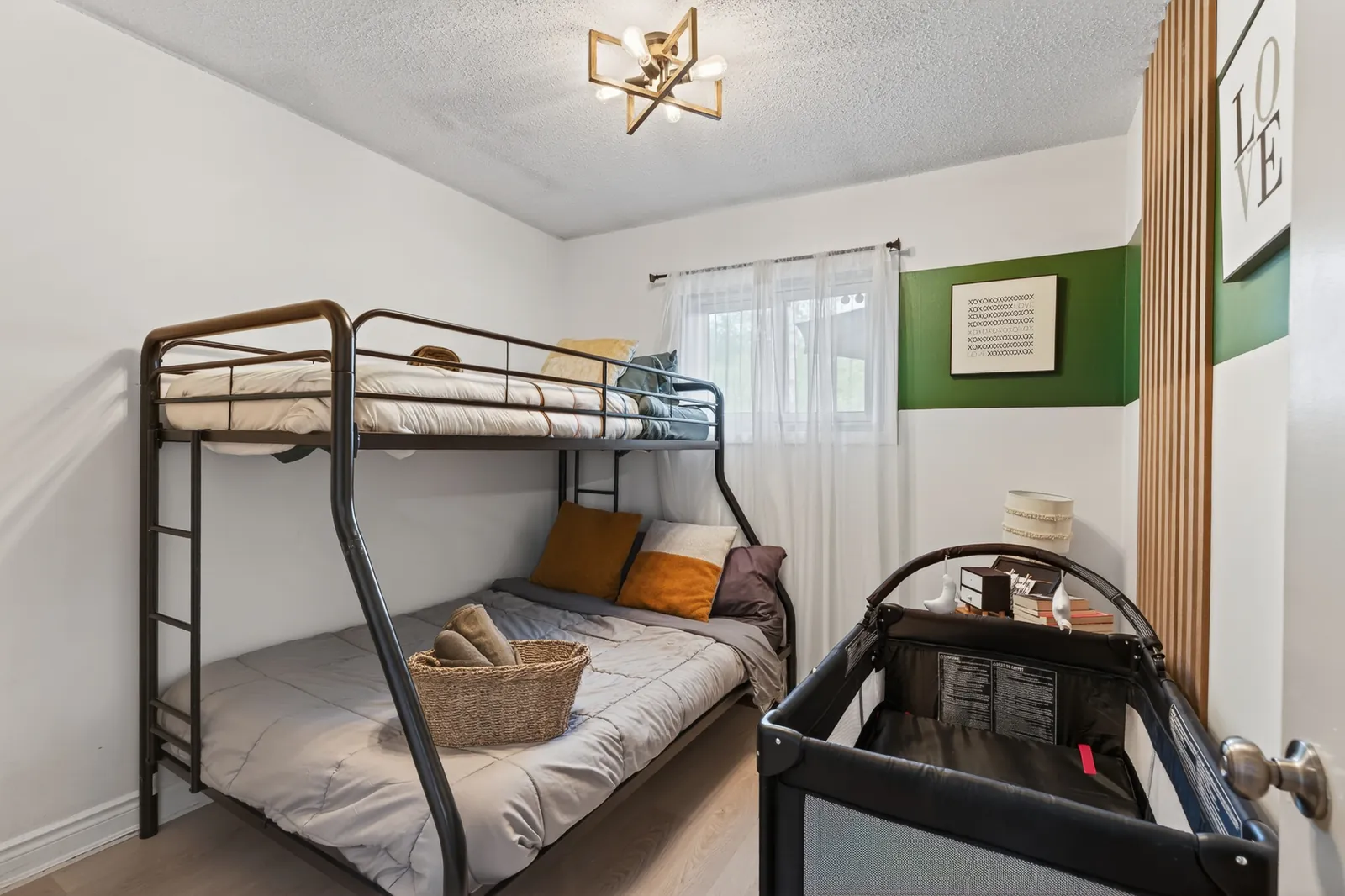 Bunk room at The Mara with a bunk bed and a travel crib