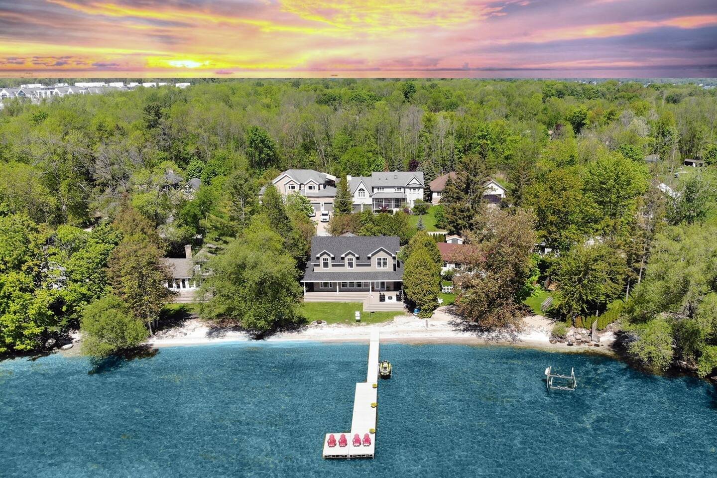 Lakefront at sunrise with private dock