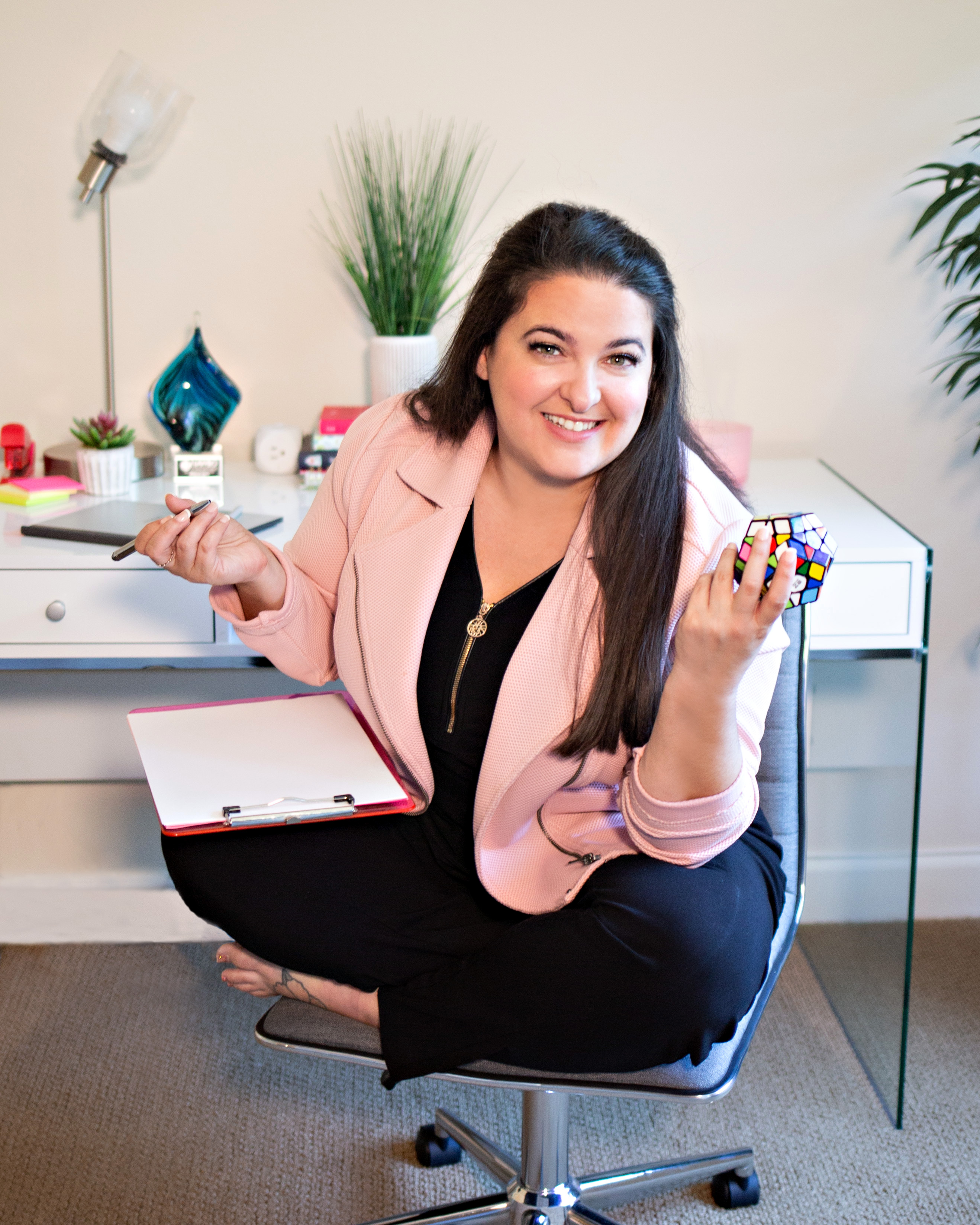 Meghan holding a Rubik's Cube in her office
