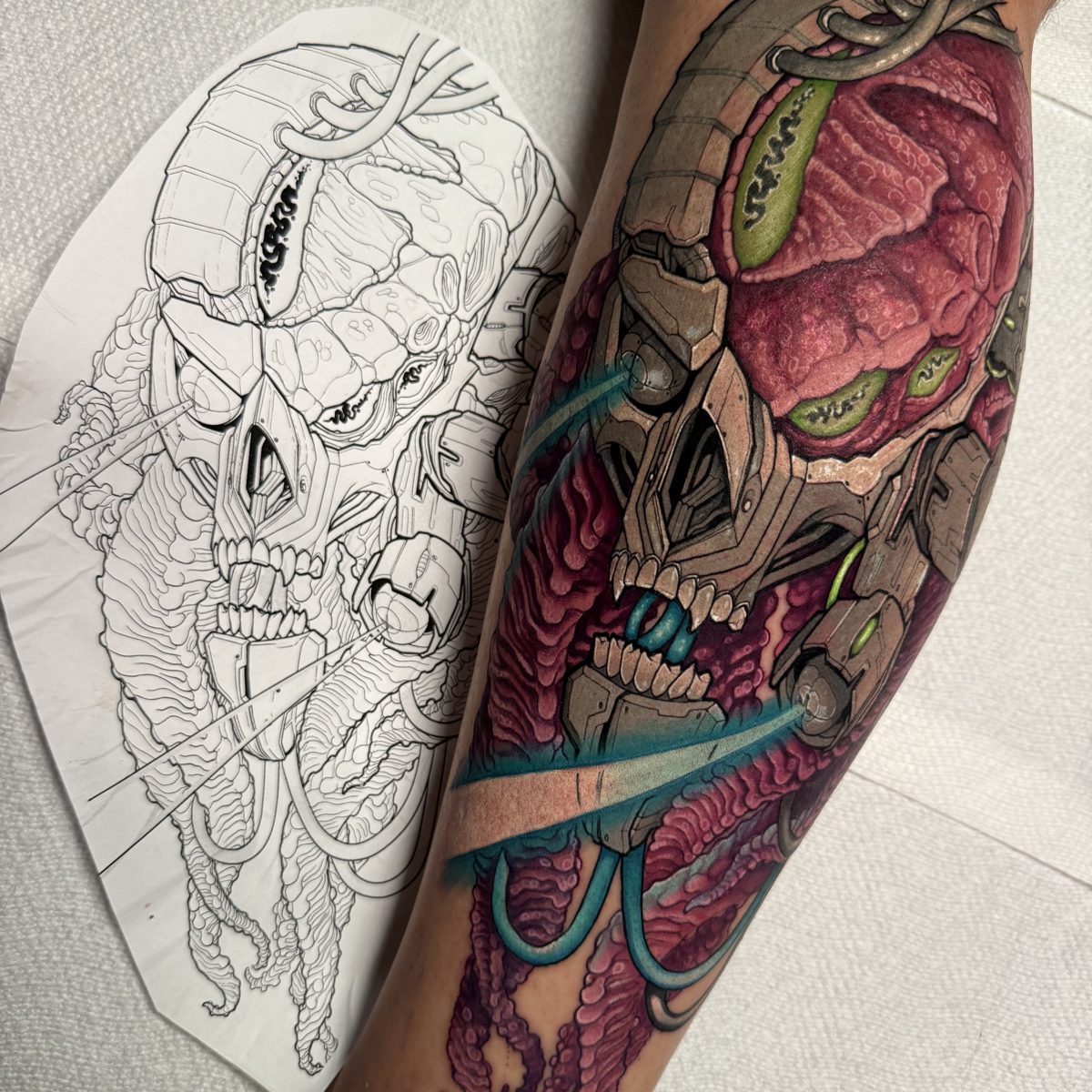 Biomechanical skull with drawing tattoo