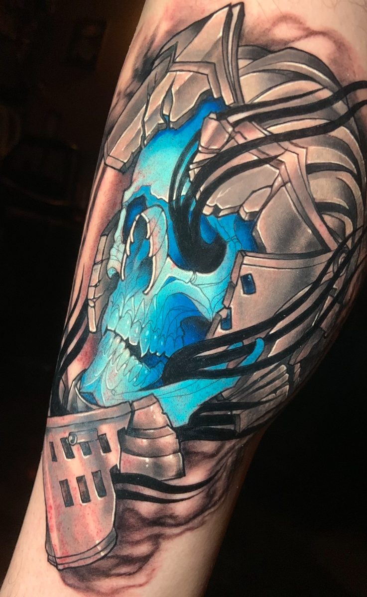 Blue skull inside an armored shell tattoo