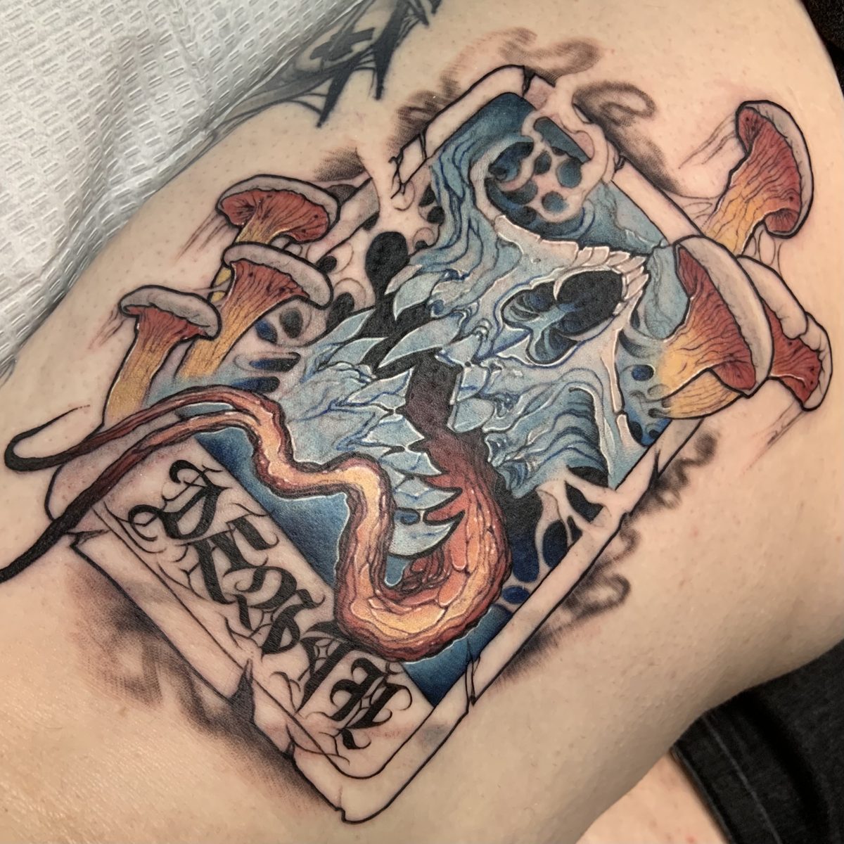 Death card with mushrooms tattoo