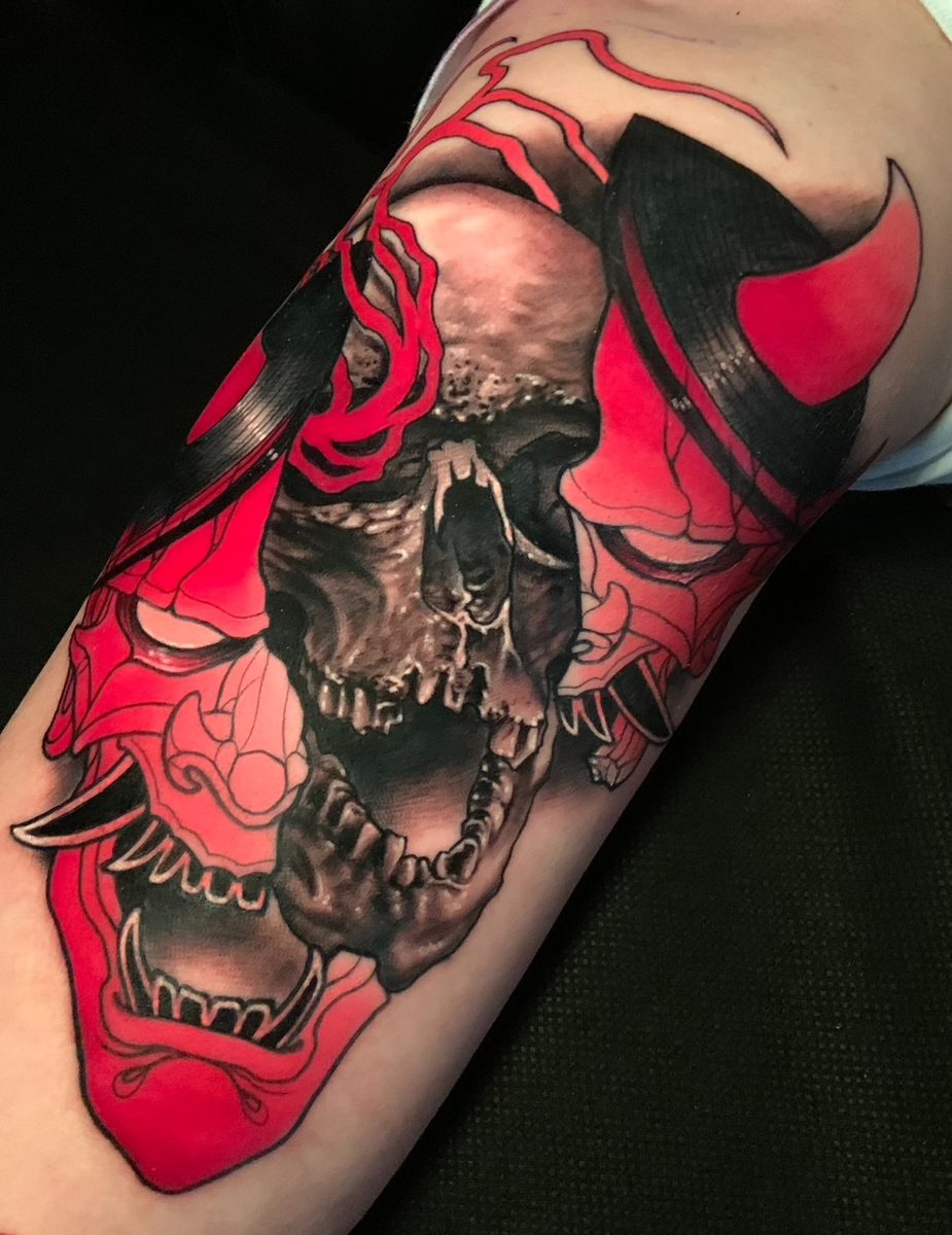 Red hannya mask and skull tattoo