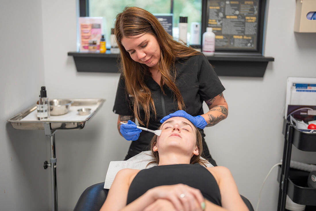 Provider performing aesthetic consultation