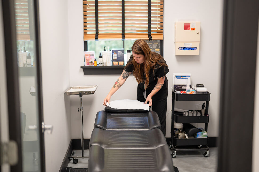 Provider performing aesthetic consultation
