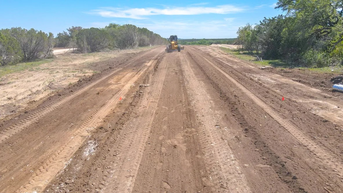 Excavation equipment clearing land for construction site preparation