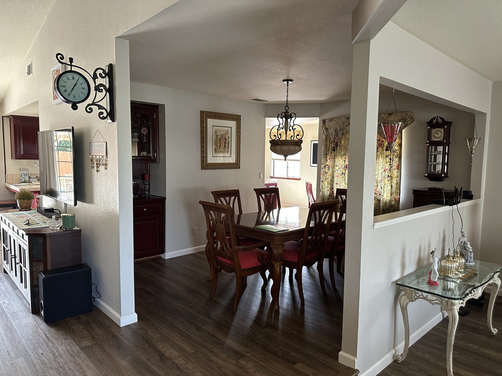 Closed-off formal dining room with half wall before renovation
