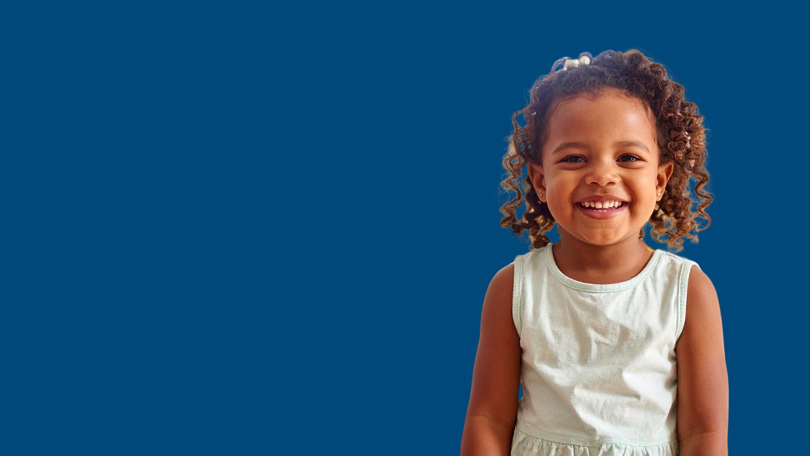 A smiling little girl in a dress A smiling little girl in a dress