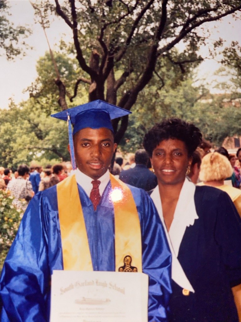 Bryan with his mother, Nancy Robinson, at his 1991 South Garland High School graduation