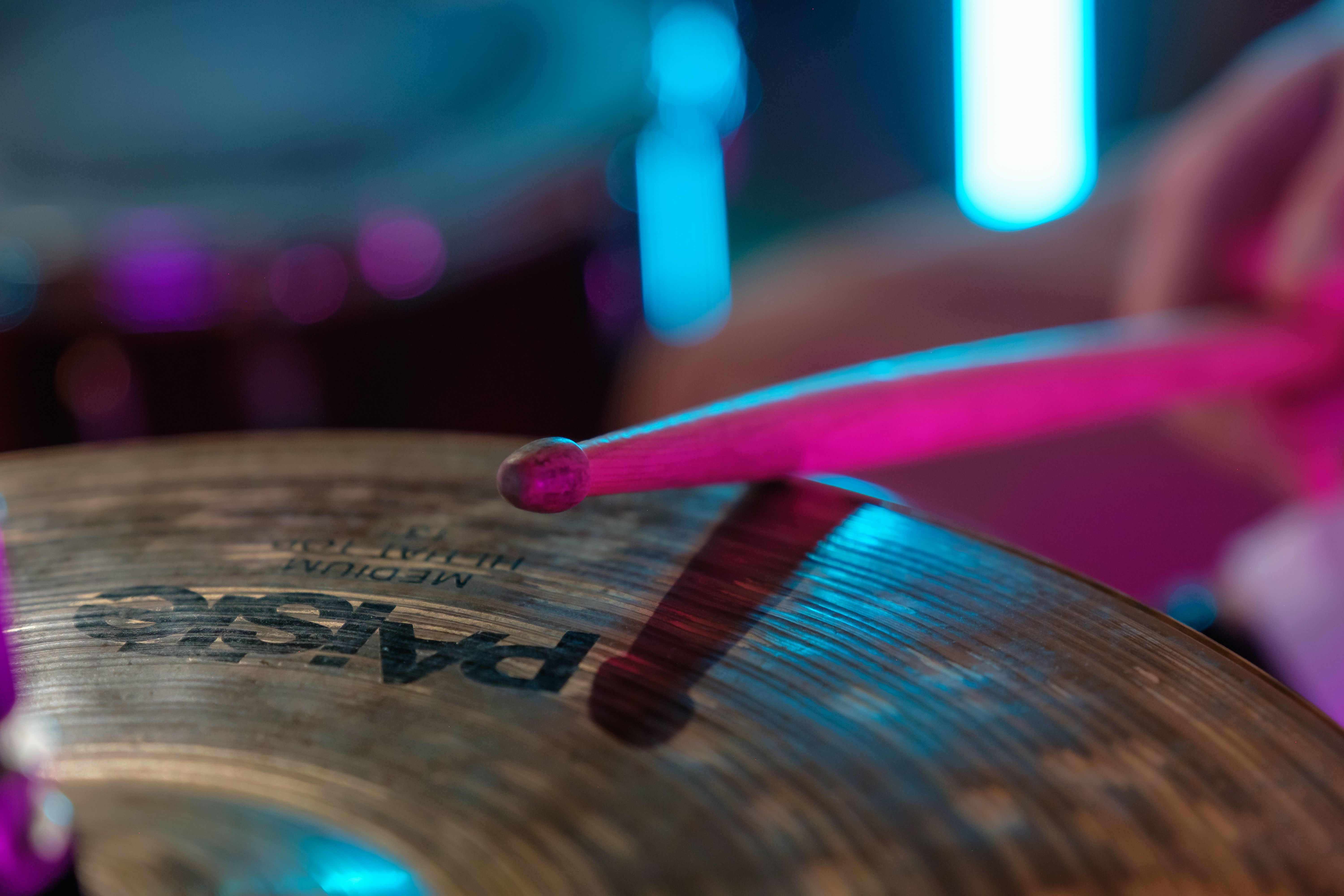 Drumstick striking a cymbal, showing the touch and feel behind a drummer's musical choices Drumstick striking a cymbal, showing the touch and feel behind a drummer's musical choices