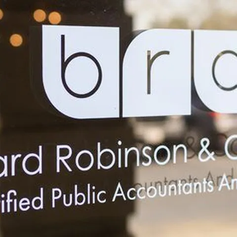 The Bernard Robinson and Company sign on the firm's office window (Photo: BRC CPAs and Advisors website)