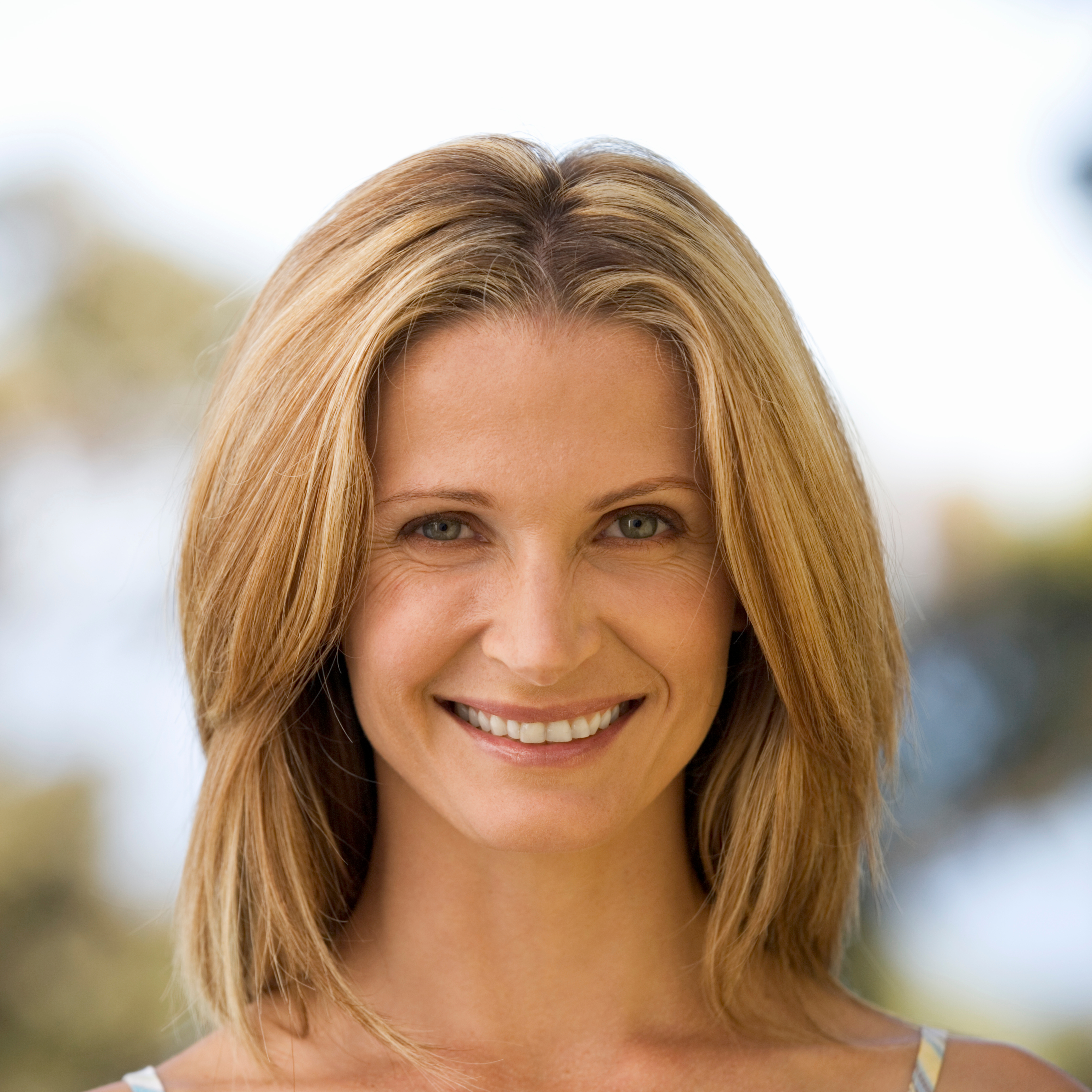 Smiling woman with healthy skin, representing natural beauty and wellness, relevant to My Ageless Lounge's focus on non-surgical aesthetic treatments in Plano, TX.