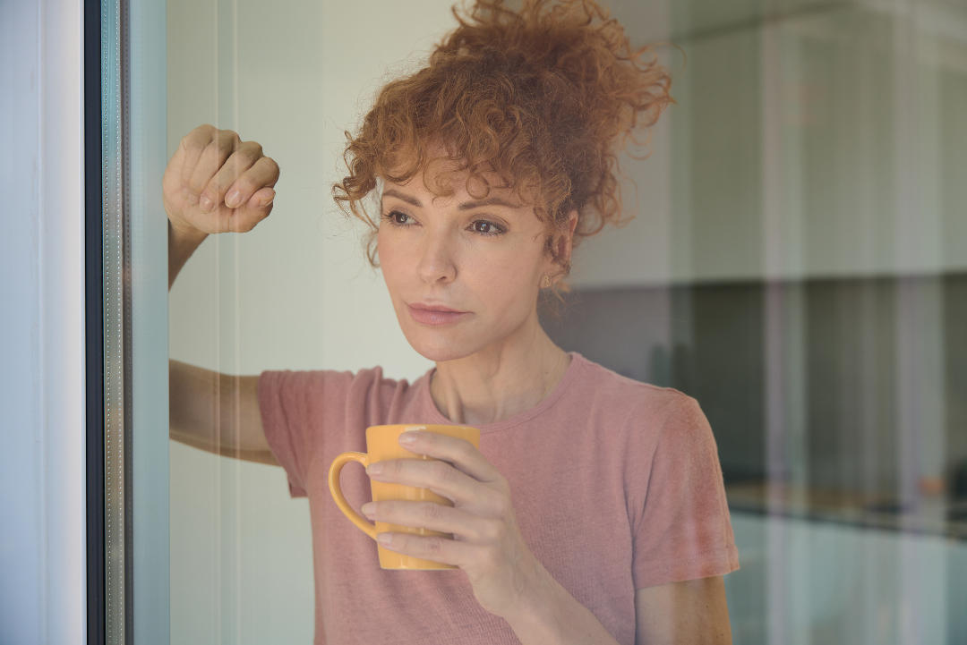 Woman reflecting on memories of drinking versus the full story of her alcohol free life Woman reflecting on memories of drinking versus the full story of her alcohol free life