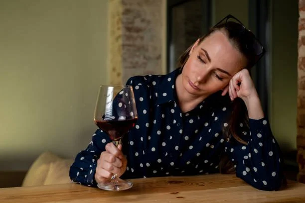 Woman reflecting on memories of drinking versus the full story of her alcohol free life