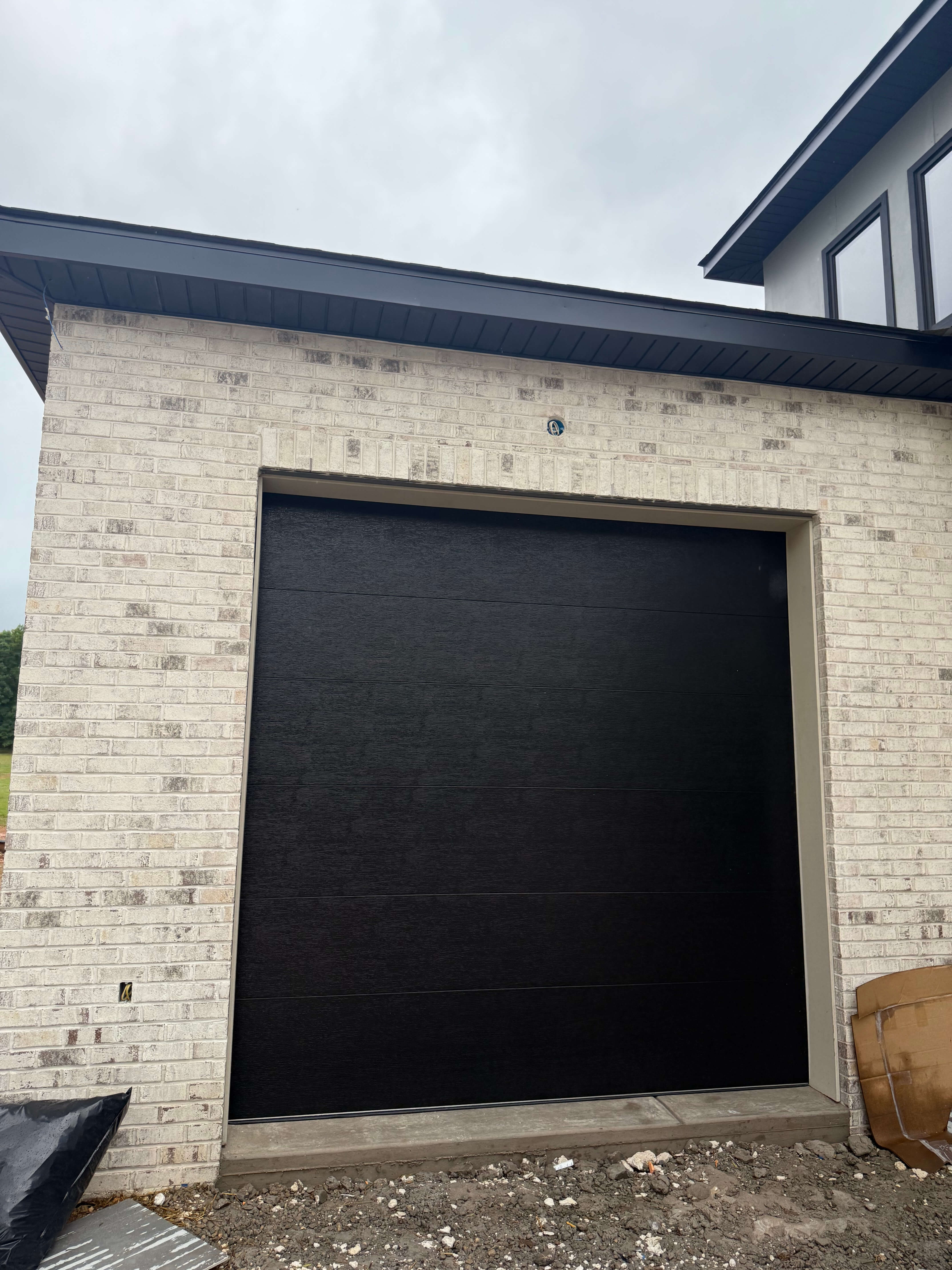 Garage door safety sensor alignment and repair in Charlotte NC