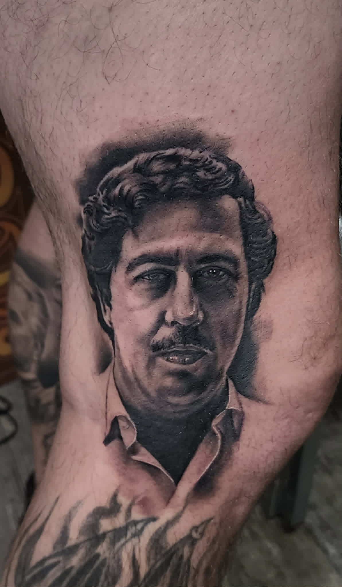 Black and grey portrait tattoo
