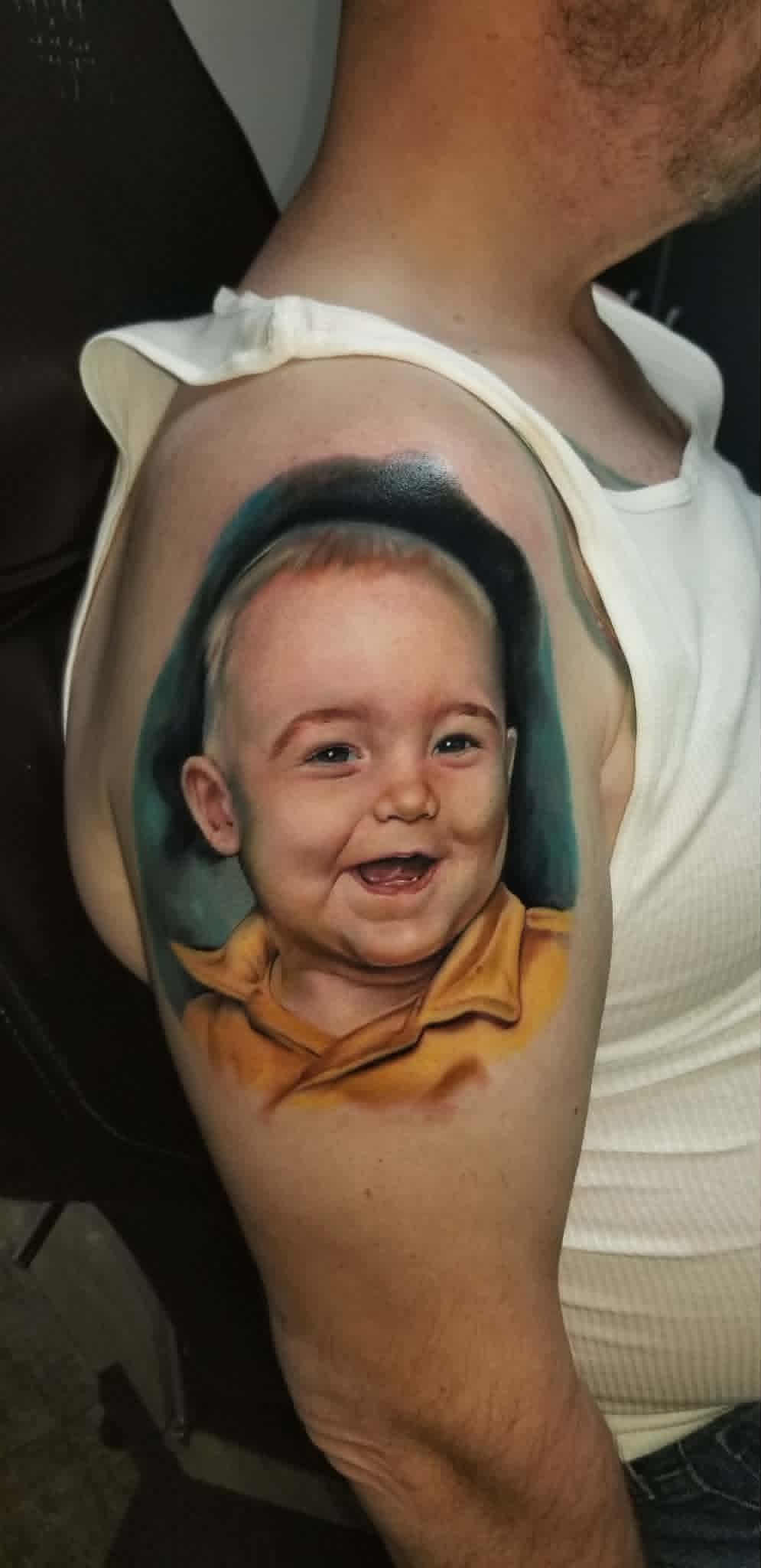 Color baby portrait tattoo