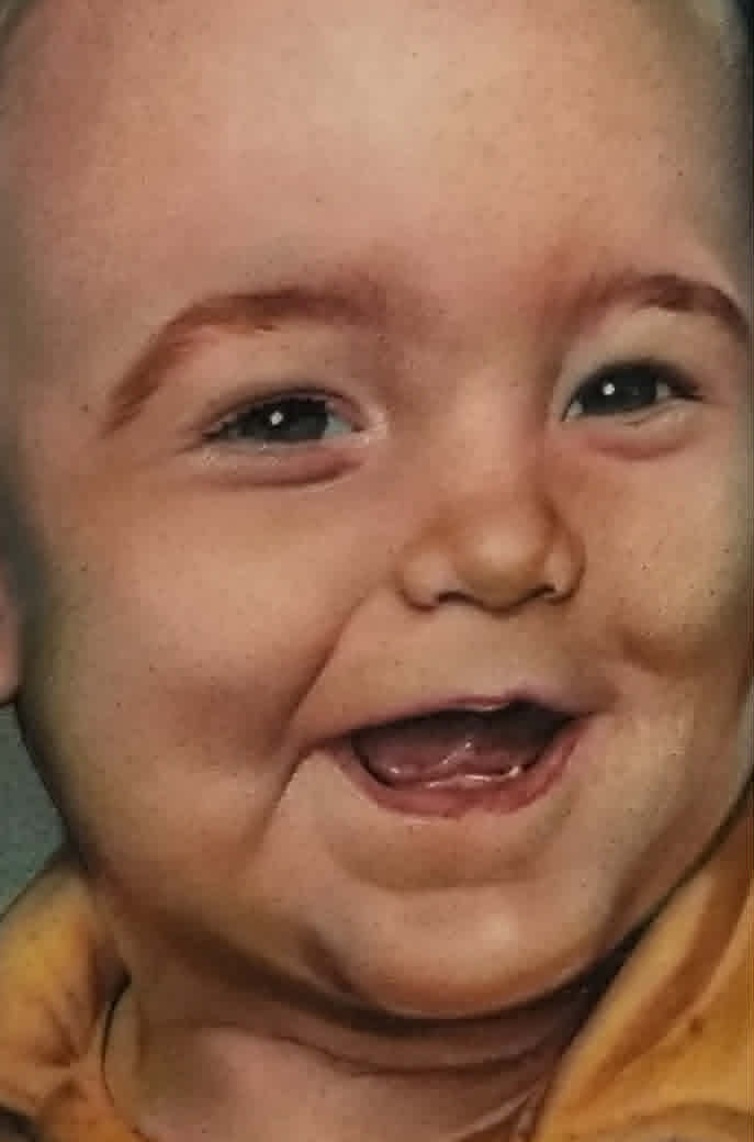Detail close-up of color baby portrait tattoo
