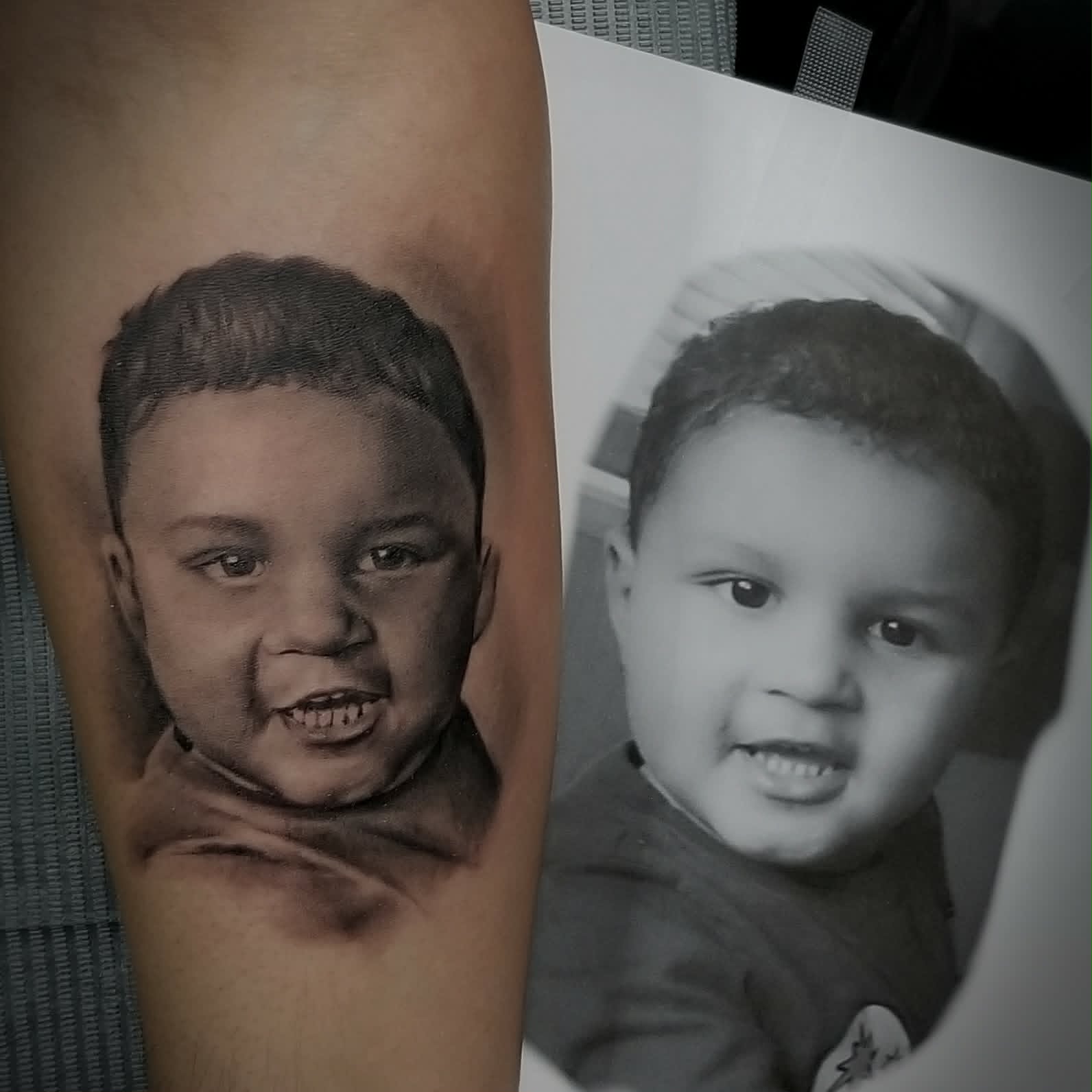 Black and grey toddler portrait tattoo, second study