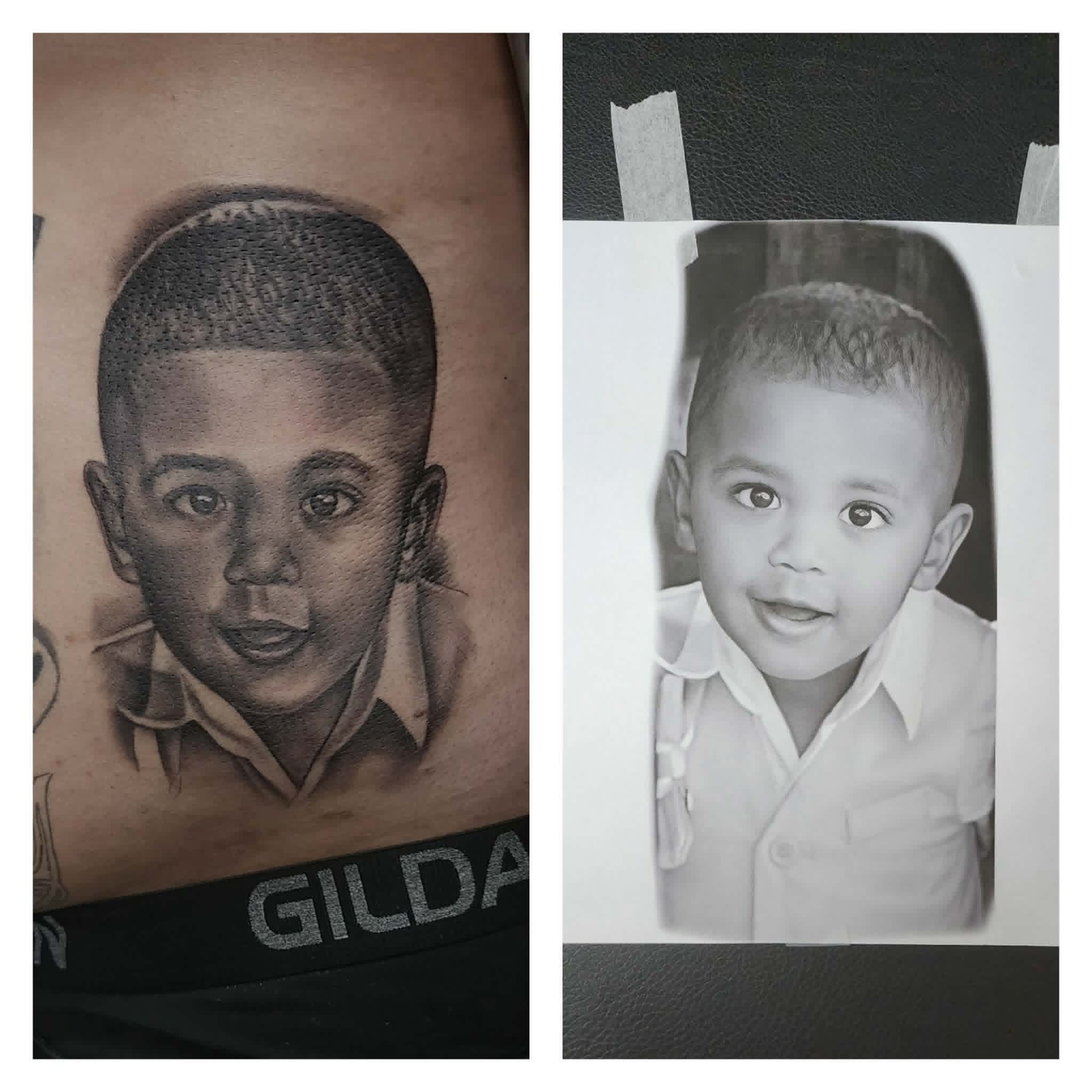 Black and grey toddler portrait tattoo