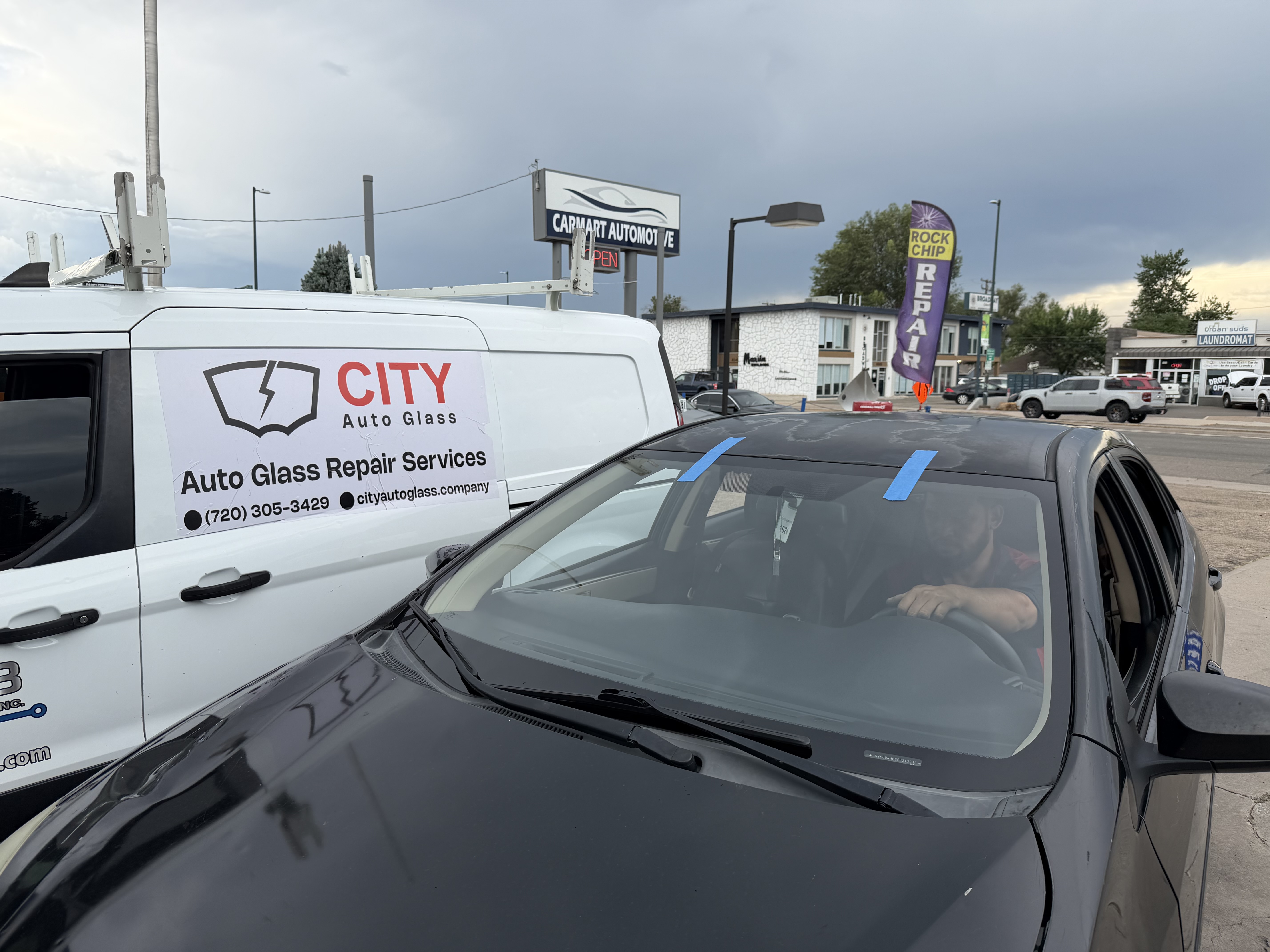city auto glass mobile windshield repair black car painters tape outdoor city auto glass van englewood co