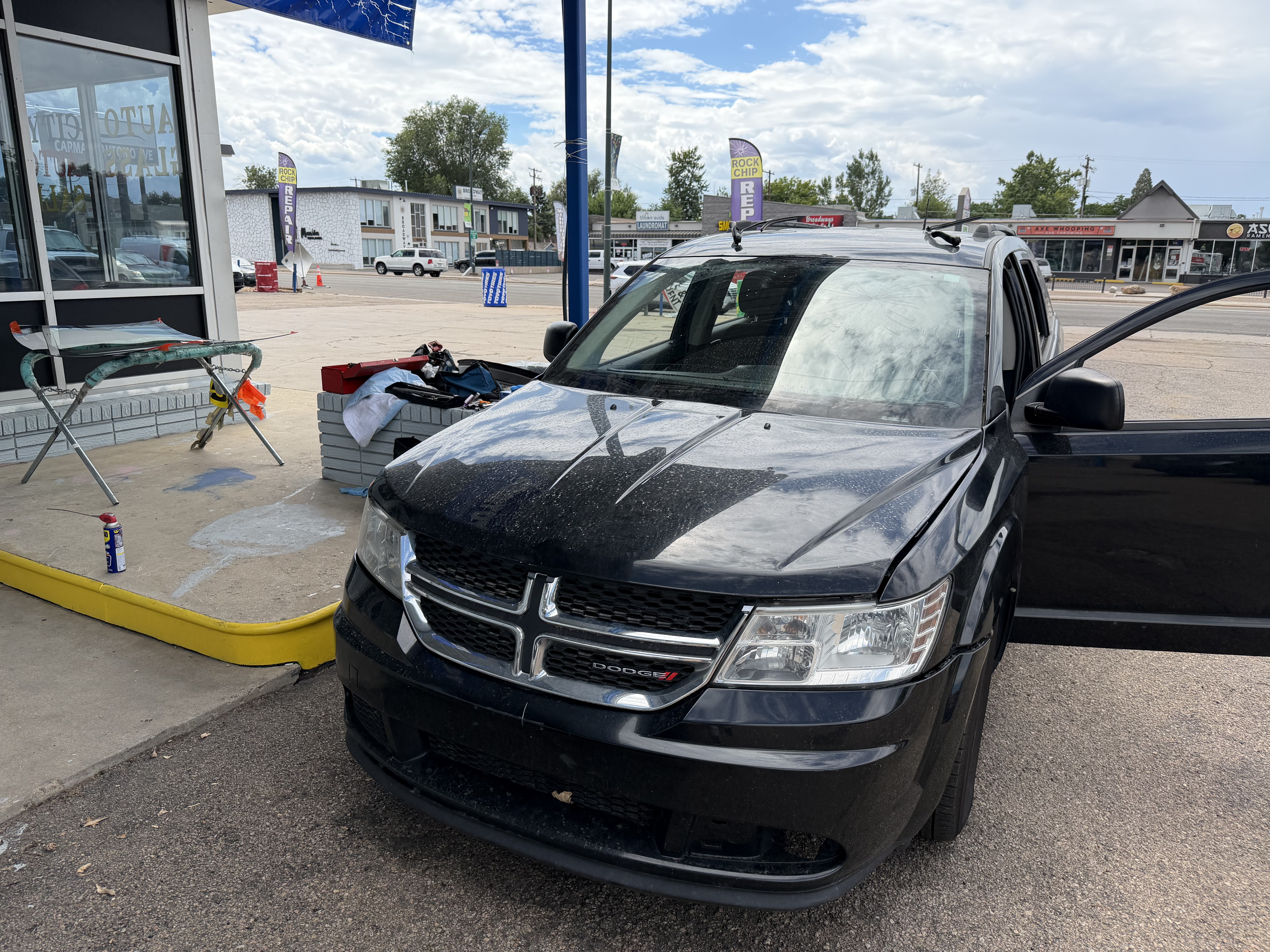 city auto glass black dodge suv cracked windshield damage intake outdoor storefront englewood co