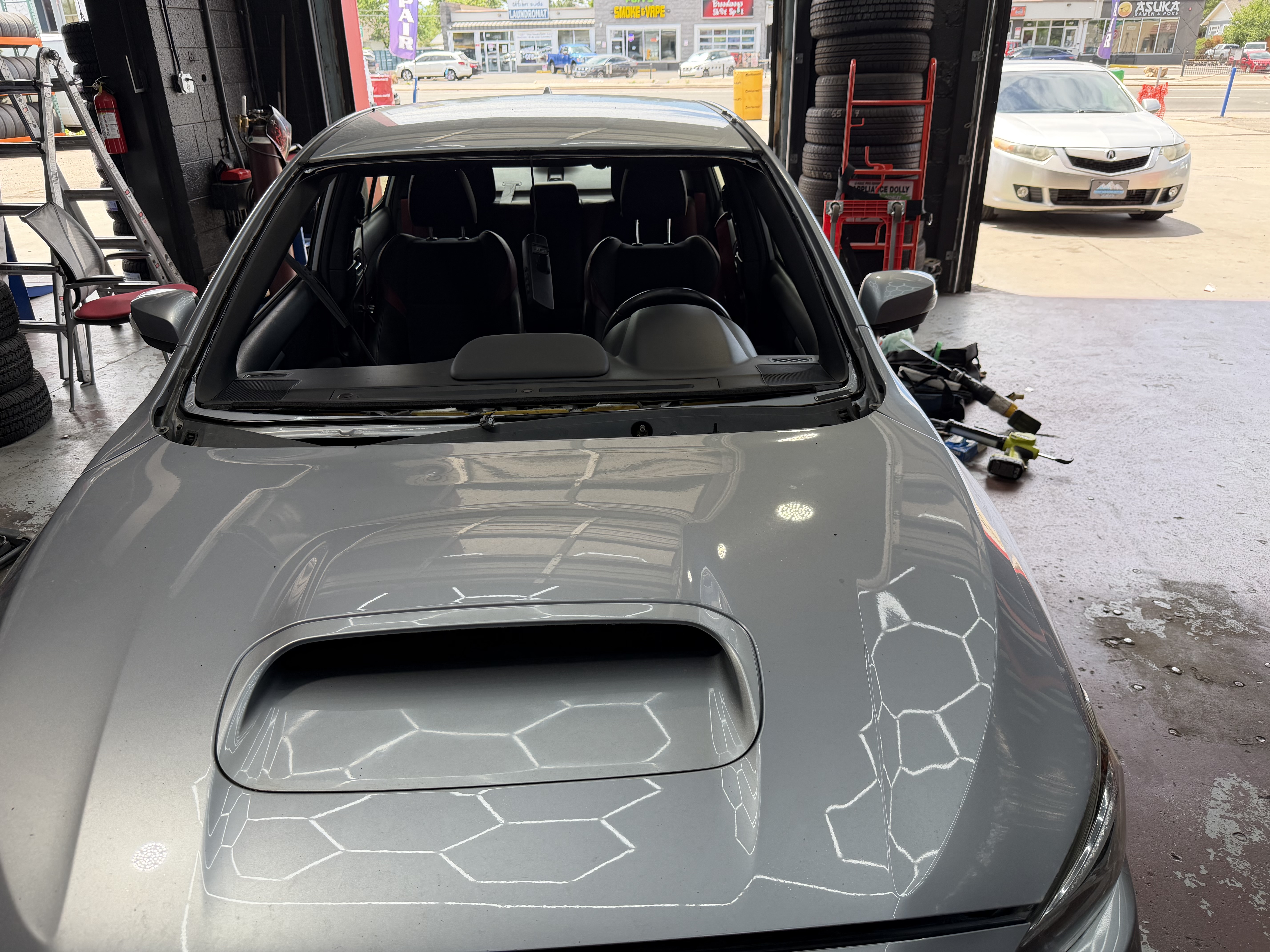 windshield removed subaru wrx sti silver empty frame indoor shop englewood co 16