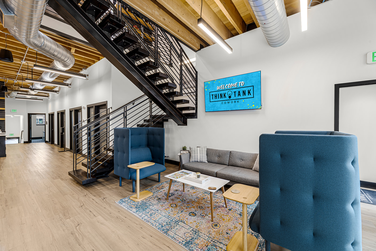 An open coworking area with desks and seating at Think Tank Cowork in downtown Everett, Washington