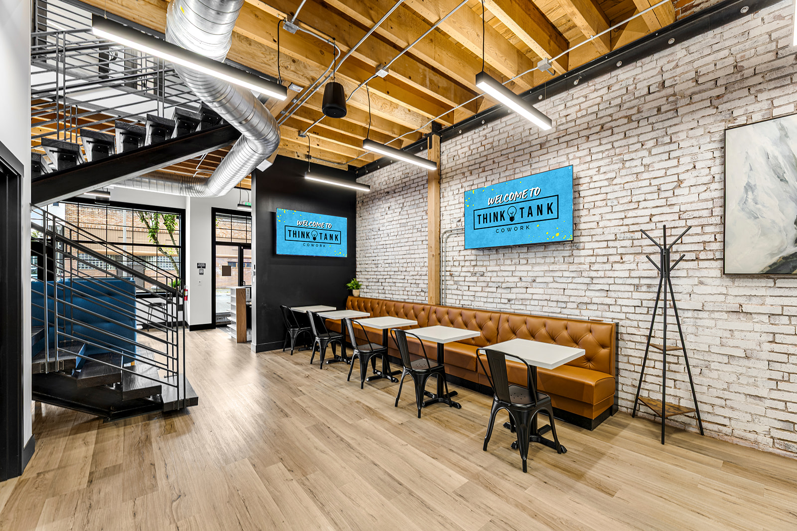 A coworking lounge area with soft seating at Think Tank Cowork in downtown Everett, Washington