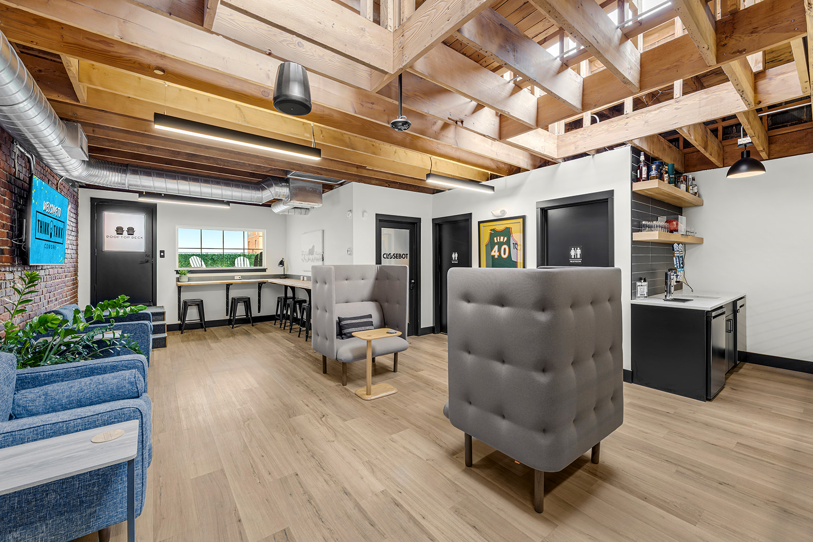 The main coworking floor with open desks at Think Tank Cowork in downtown Everett, Washington
