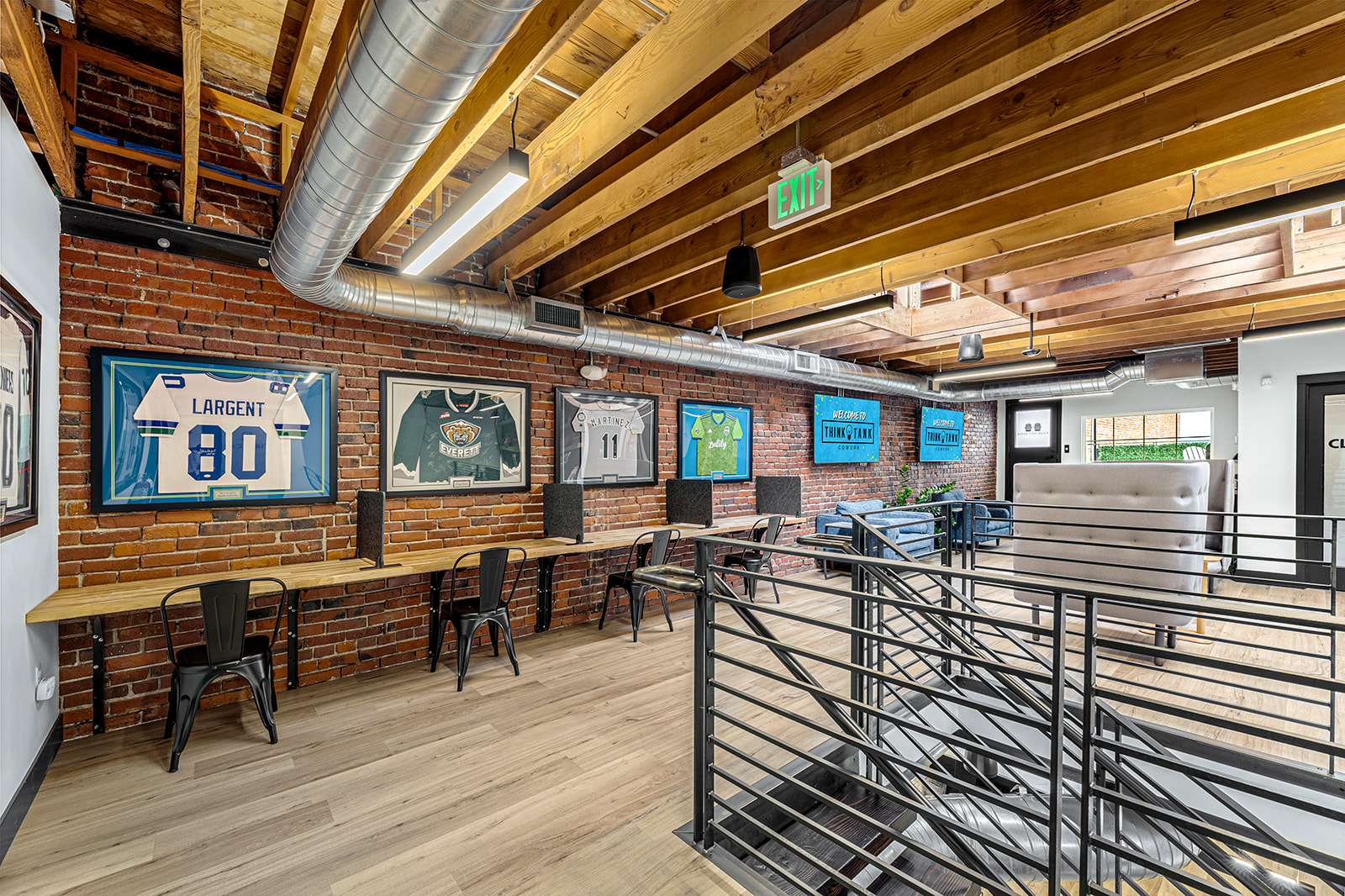 Members working at desks on the main floor at Think Tank Cowork in downtown Everett, Washington