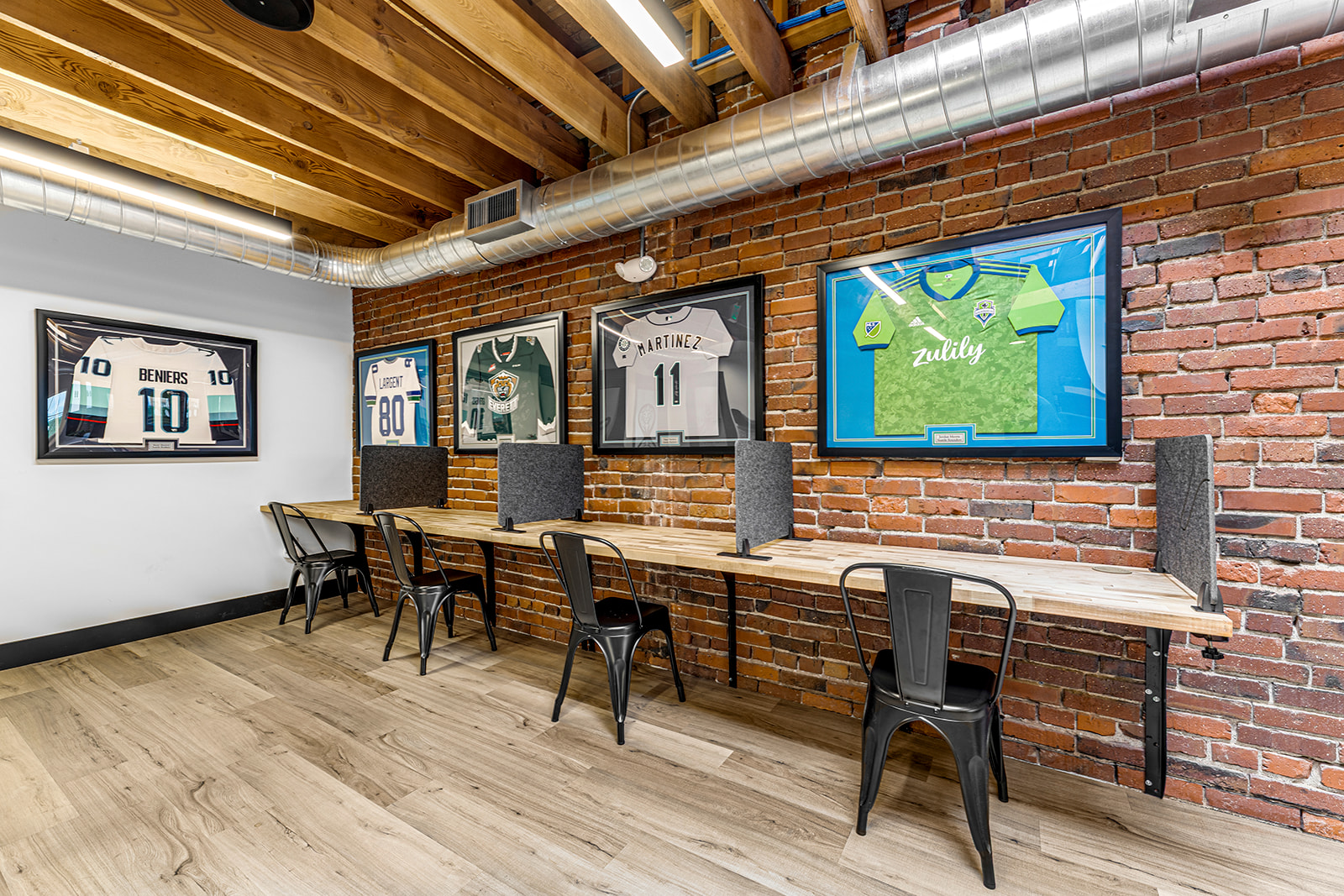 Hot desks available to coworking members and day pass holders at Think Tank Cowork in downtown Everett, Washington