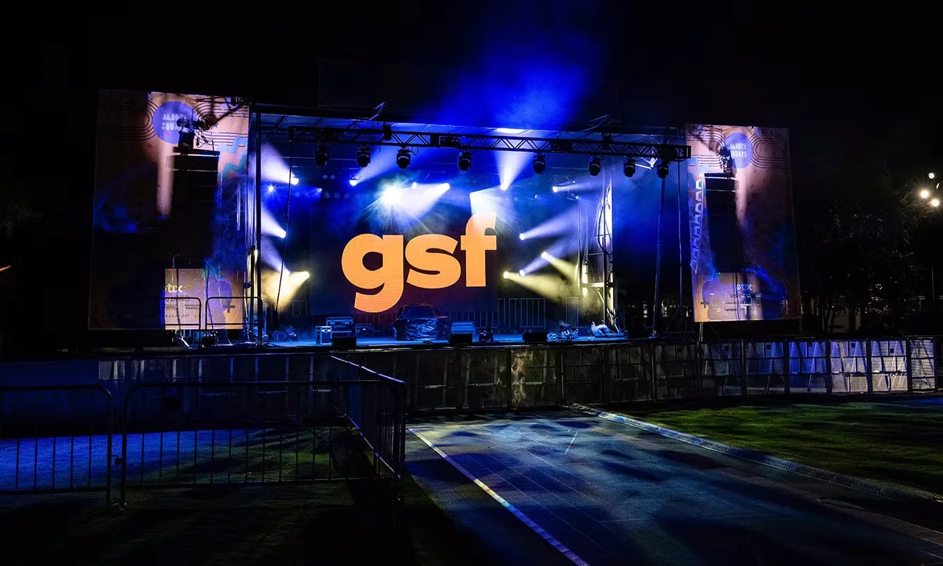 Concert stage with lighting beams and LED screens