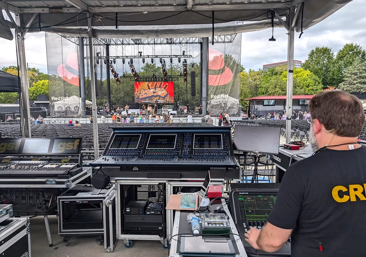 Professional line-array speakers on stage truss