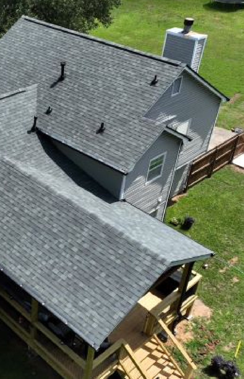 Shingle roof installation with covered porch in Conyers, Georgia by Elite Roofing & Outdoor Construction — durable roofing for modern homes