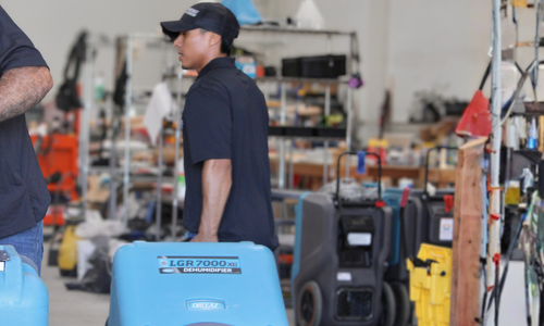 SunCoast Restoration technician with branded vehicle