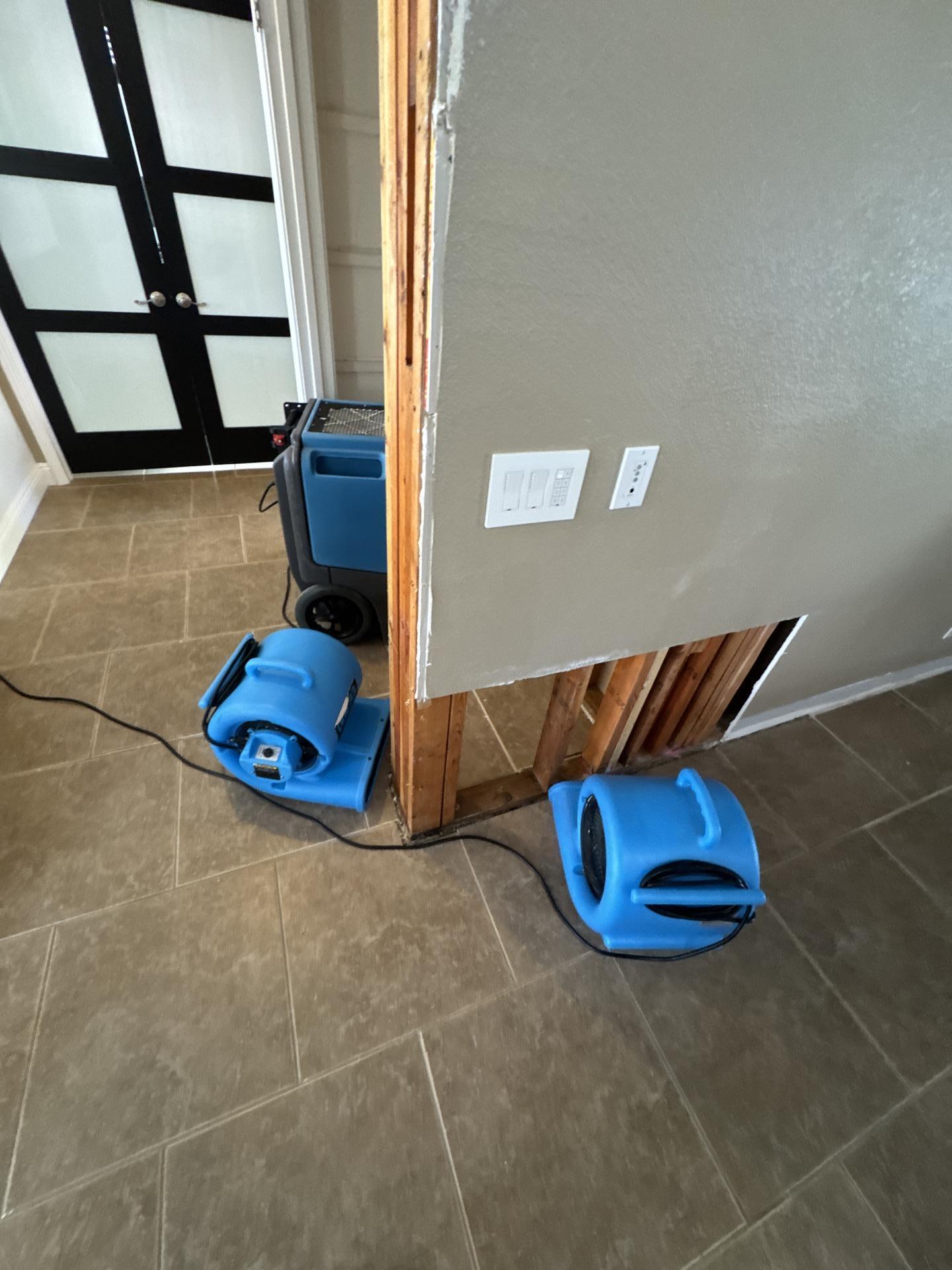 Professional drying equipment operating at a SunCoast Restoration flood damage project