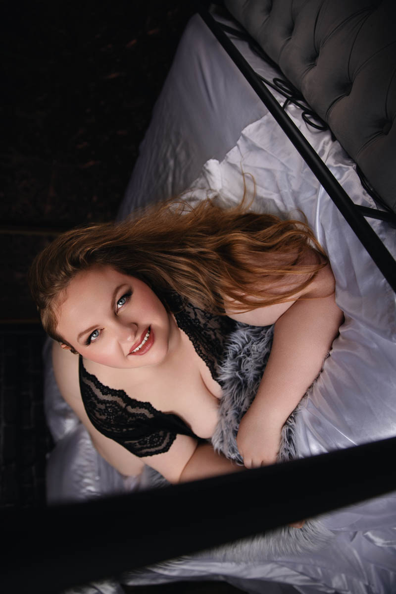 A woman in lingerie poses for a boudoir shoot in Indianapolis at Enchanted Moments Artistry A woman in lingerie poses for a boudoir shoot in Indianapolis at Enchanted Moments Artistry