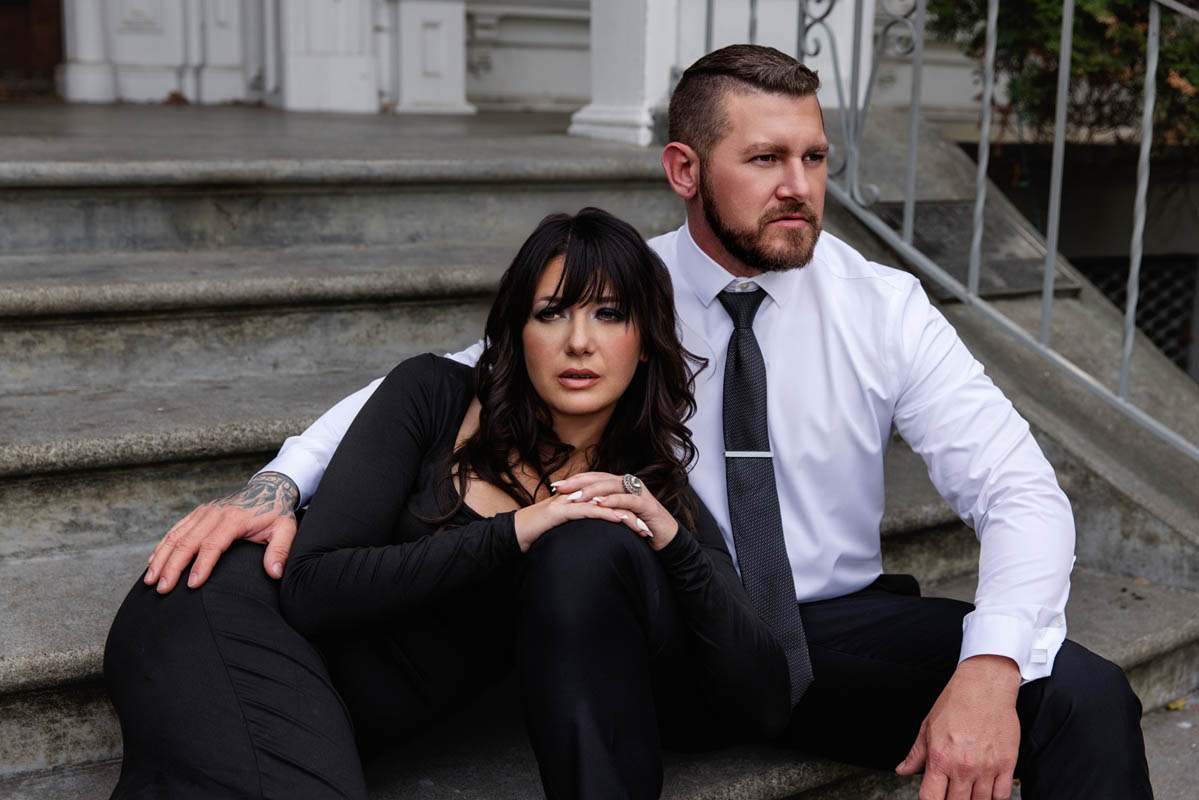 A man and woman pose as a couple for a boudoir shoot in Indianapolis at Enchanted Moments Artistry