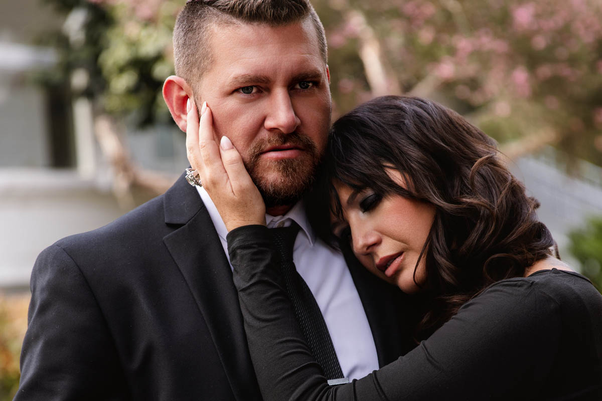 A couple poses for a boudoir shoot in Indianapolis at Enchanted Moments Artistry