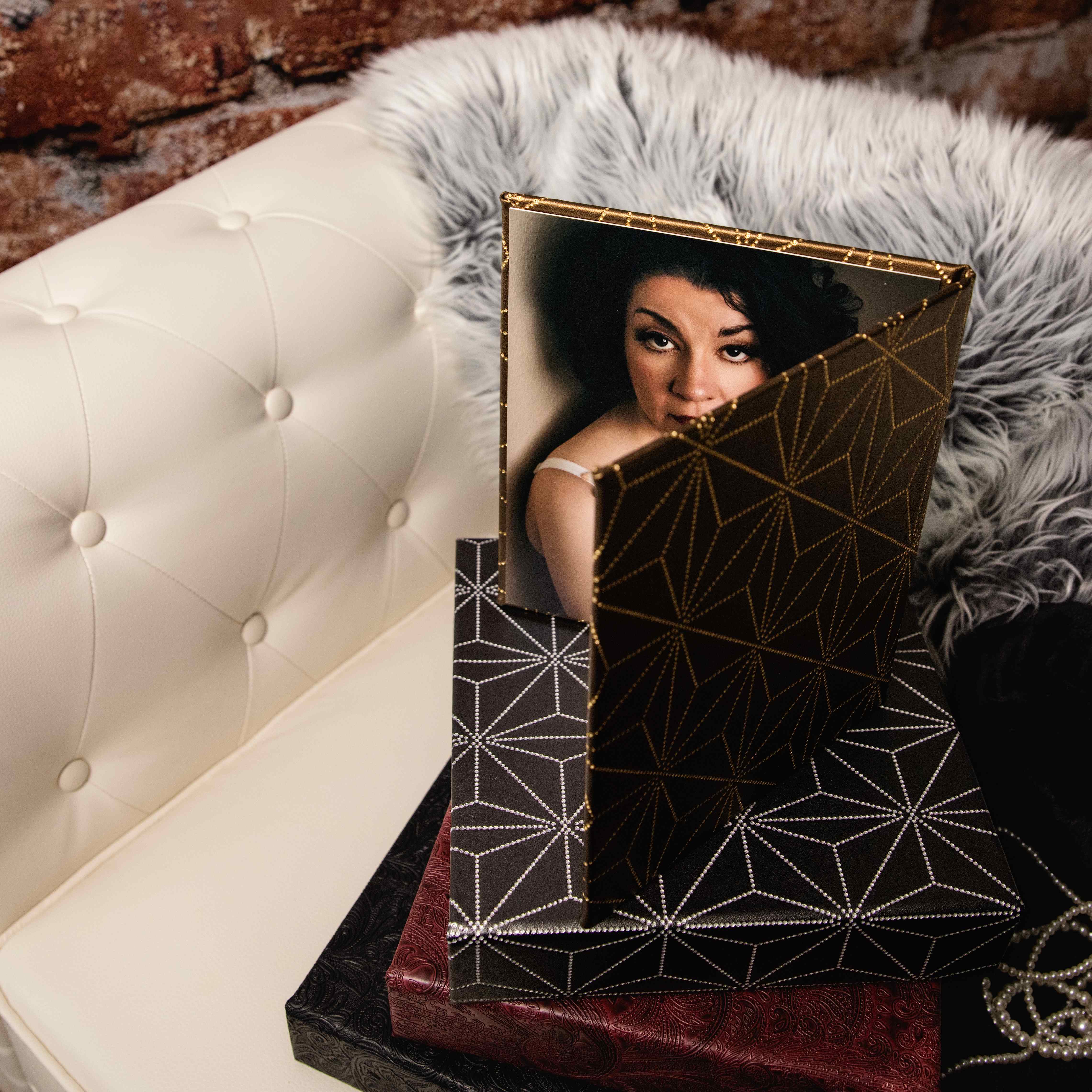 Ornate photo album showing a woman in lingerie posing for a boudoir shoot in Indianapolis at Enchanted Moments Artistry Ornate photo album showing a woman in lingerie posing for a boudoir shoot in Indianapolis at Enchanted Moments Artistry