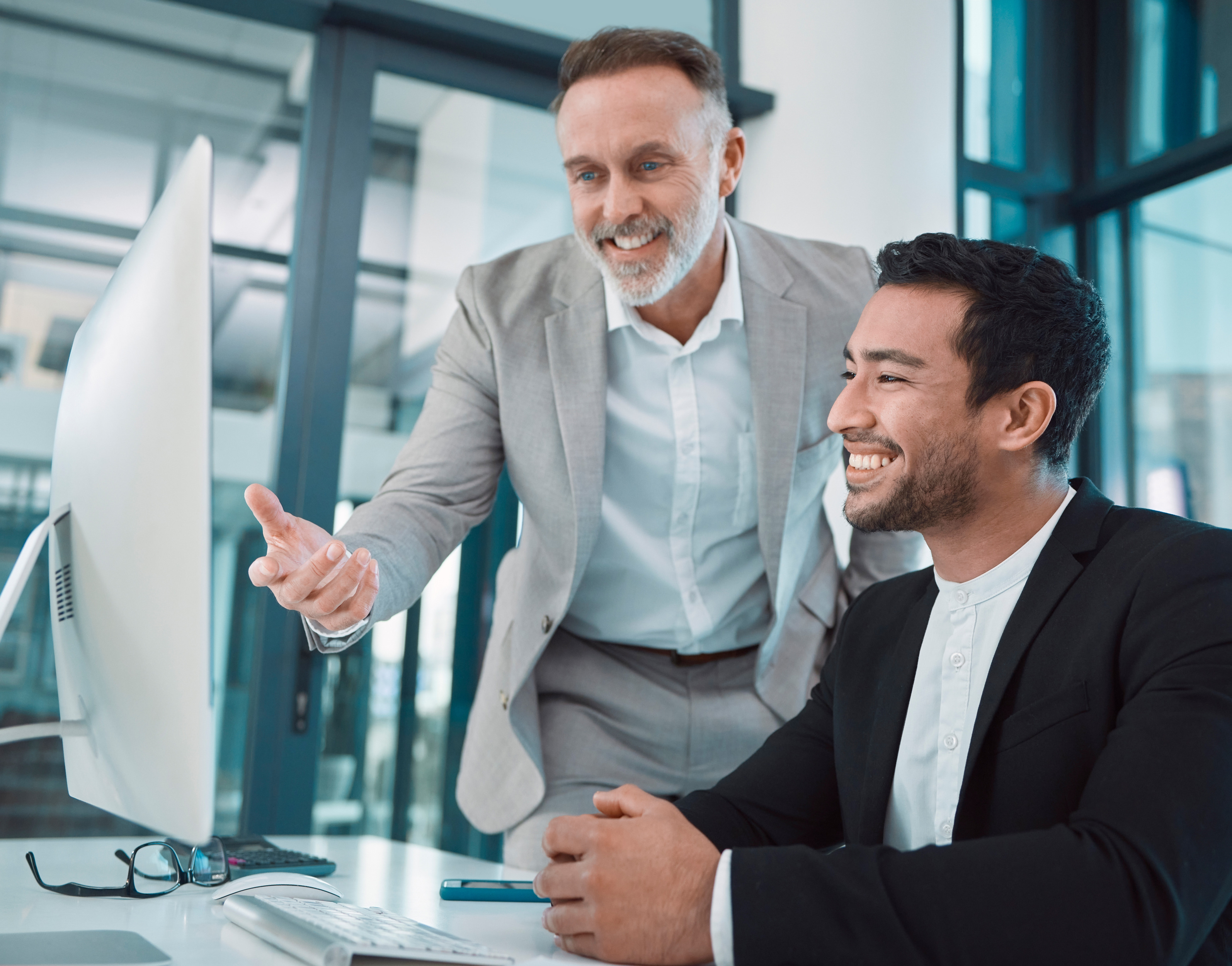 Bookkeeping advisor reviewing financial reports with small business owner