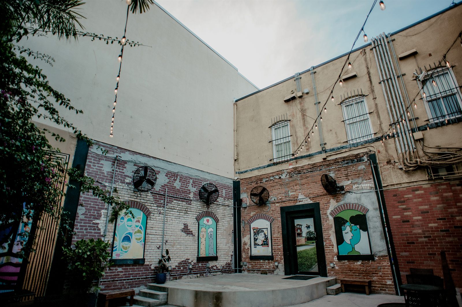 The Bricks courtyard with murals, stage and seating