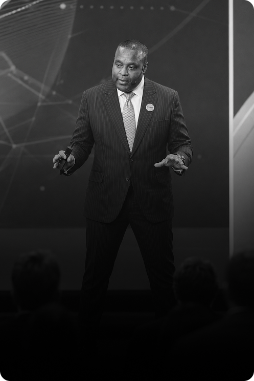 Dr. Anth Raybourne speaking on stage