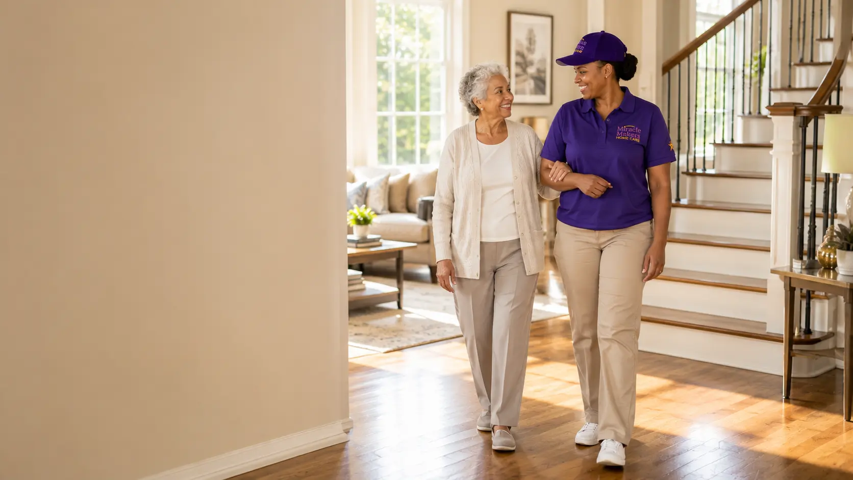 Caregiver providing safe walking and mobility assistance to an elderly client