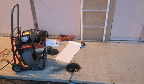 Professional drain cleaning equipment clearing clogged household drain in Coachella Valley