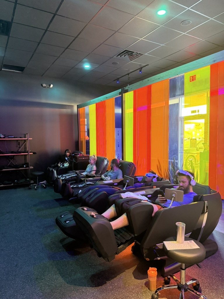 BrainTap massage chair room with premium chairs at Evolve wellness center