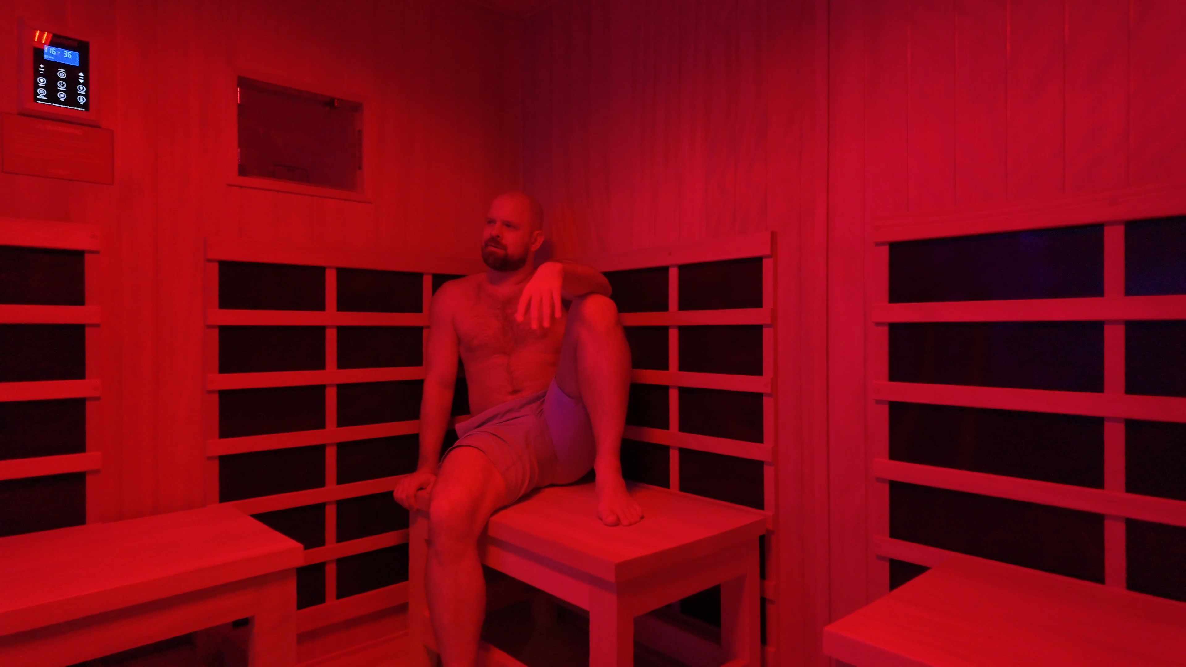 Two women relaxing together in infrared sauna at Evolve