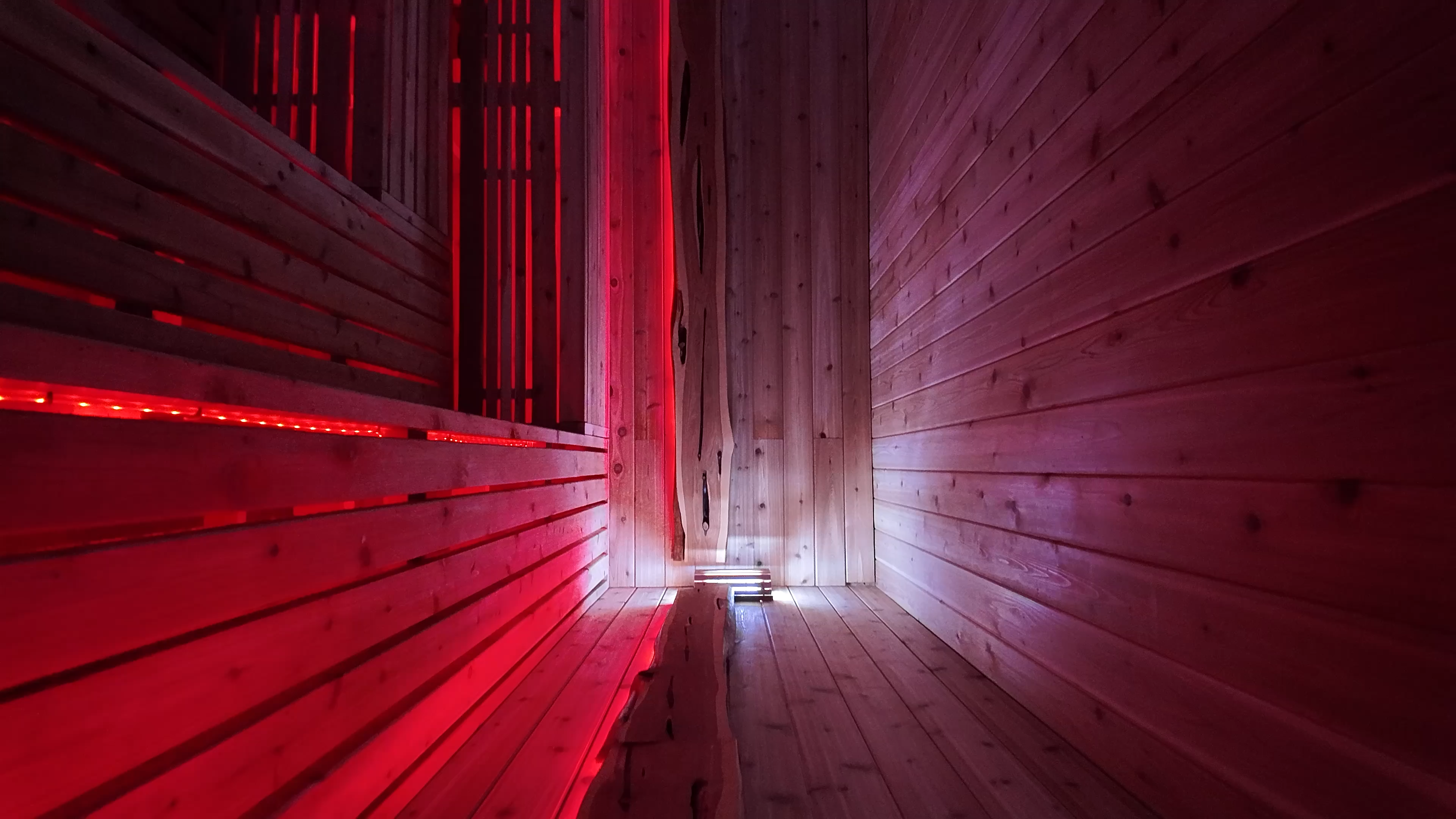 Infrared sauna interior with warm red glow