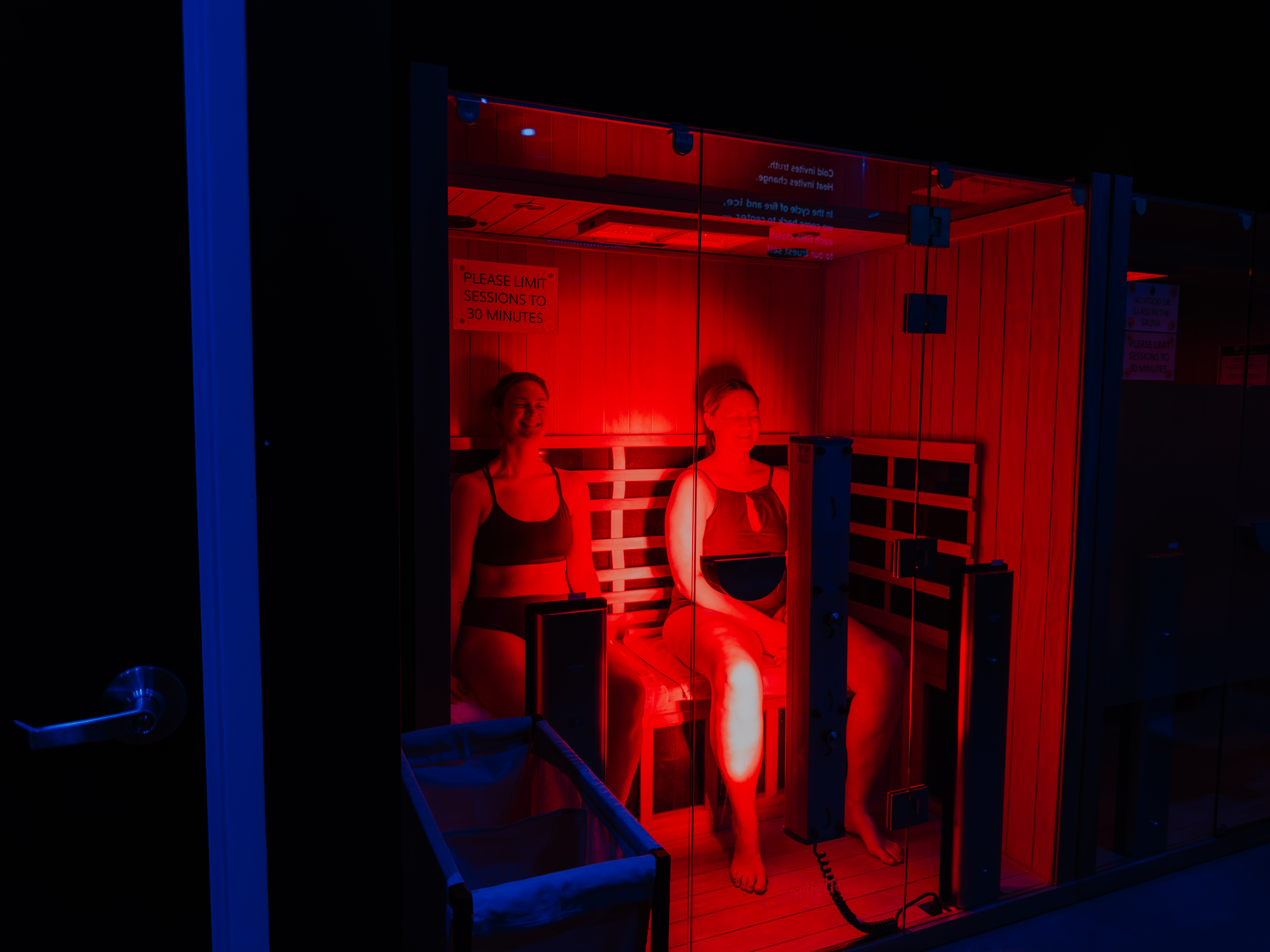 Man relaxing in infrared sauna session at Evolve